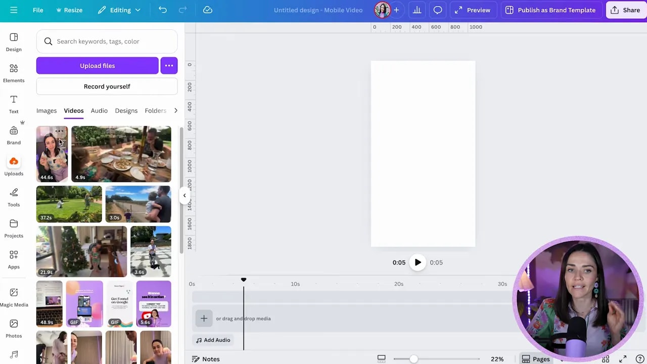 Canva editor showing the Uploads panel with the Videos tab open, blank mobile canvas, and timeline